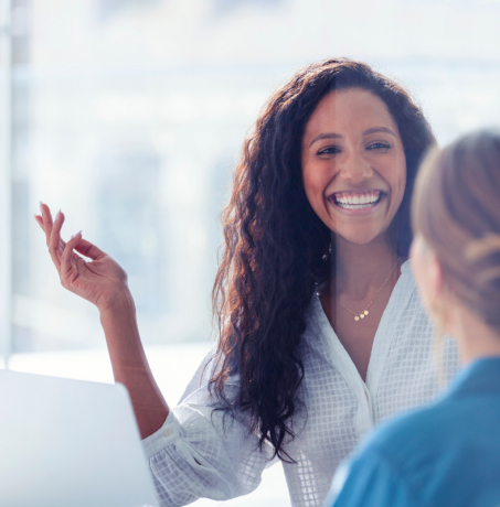 Benecard Woman Smiling at Colleague