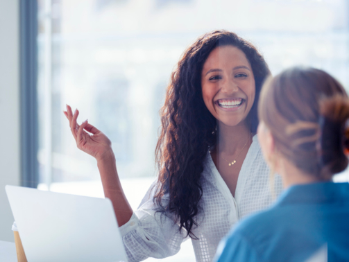 Benecard Woman Smiling at Colleague