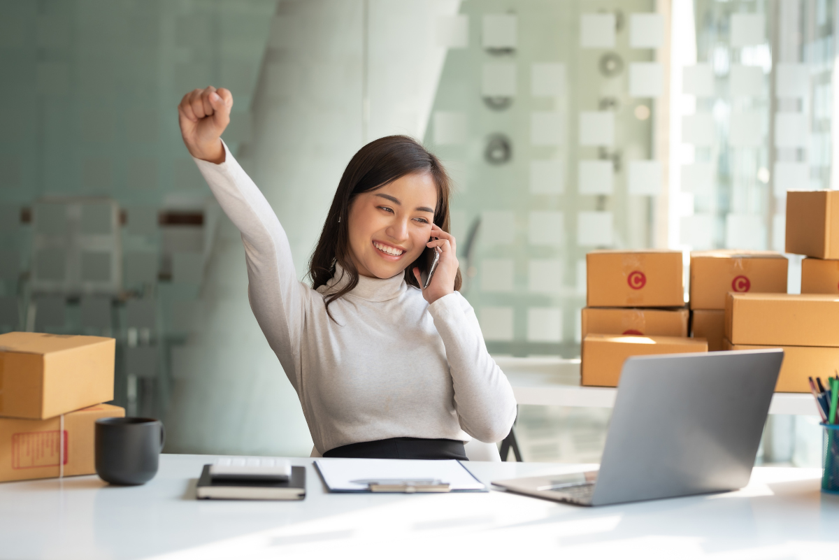 Benecard Young Asian Woman Cheering on Phone