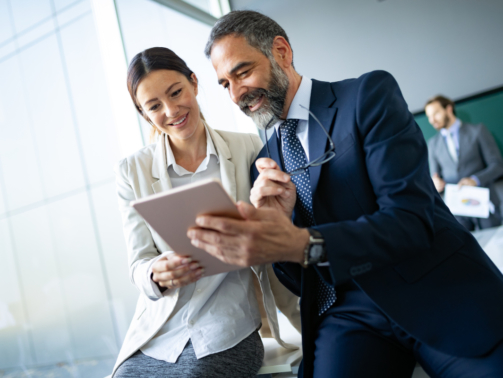 benecard Man and Woman on Tablet