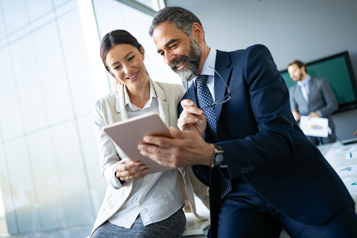 benecard Man and Woman on Tablet