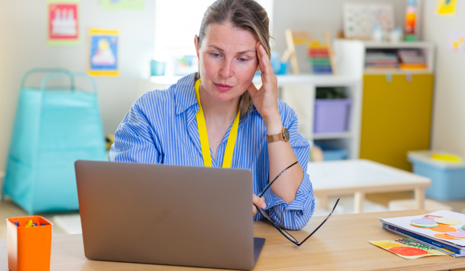 Teachers looking stressed while reviewing the computer screen